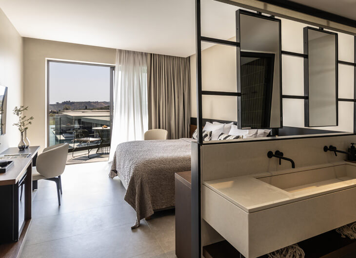 King Jason Zante Superior Suite bedroom and view